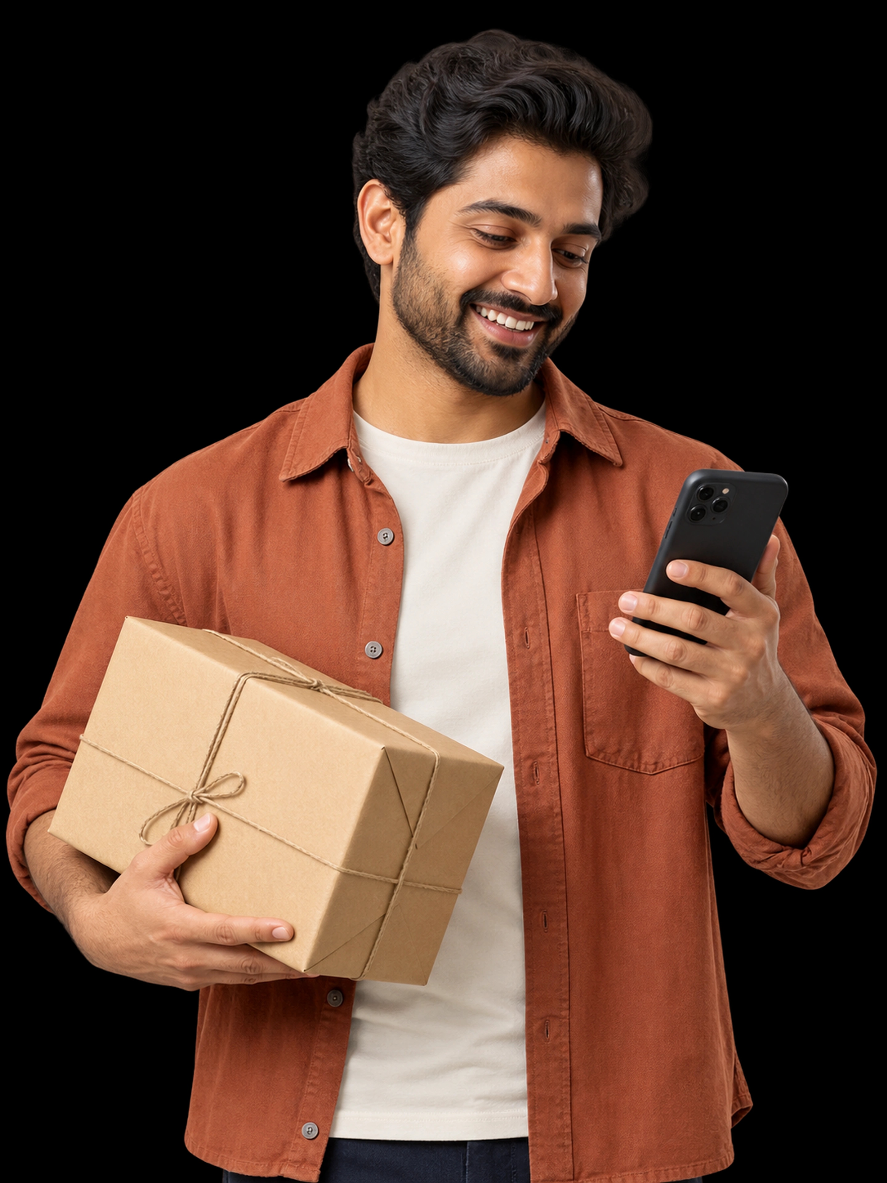 A small-business owner checking customer orders and holding a parcel